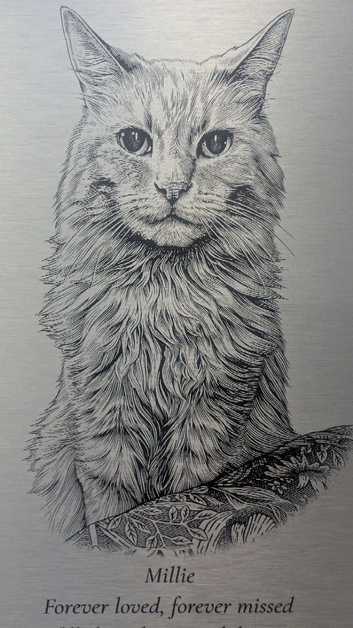 The same portrait engraved on Millie’s finished metal plaque